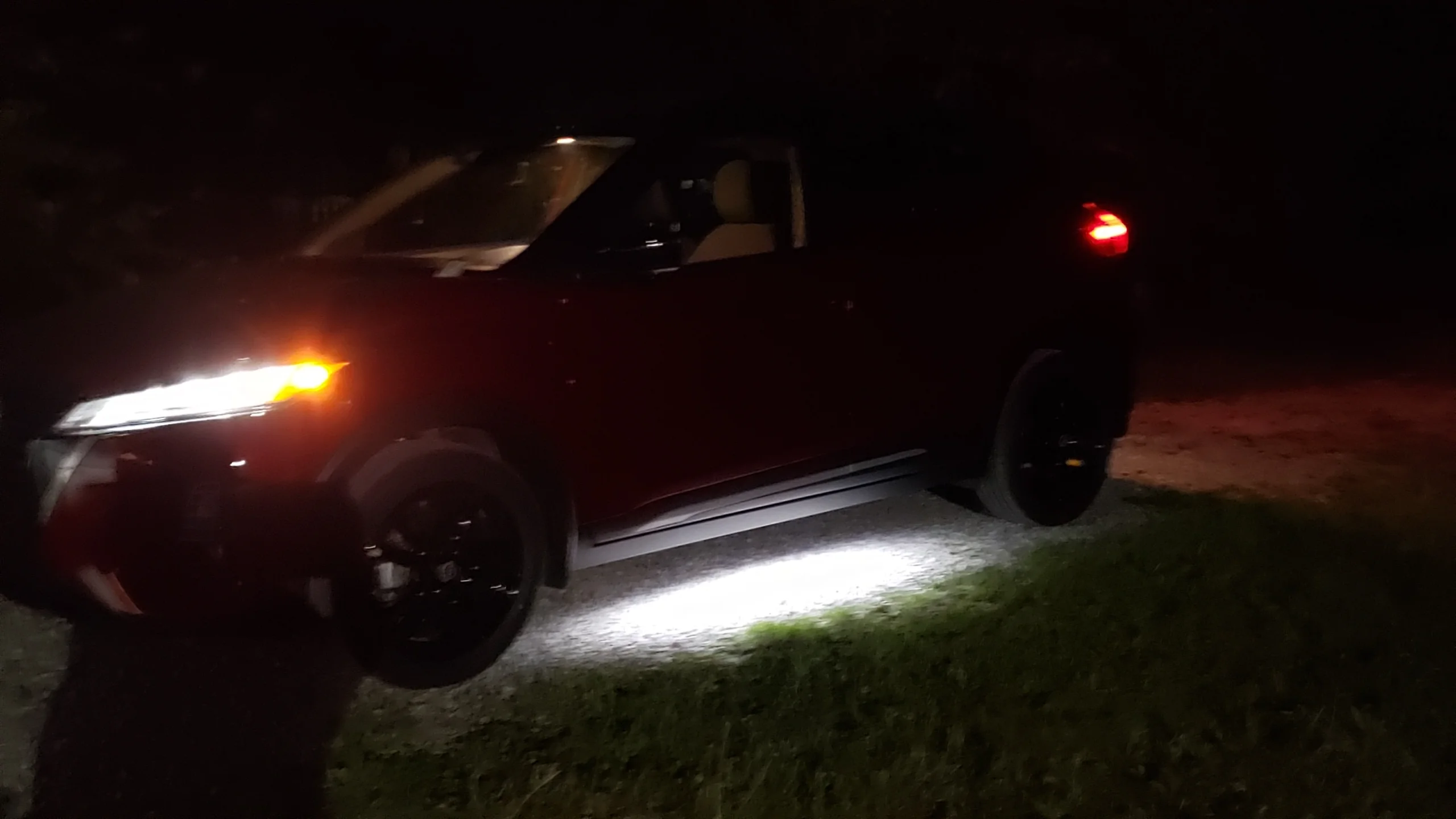 Kicks 2022 at night with underlight.webp